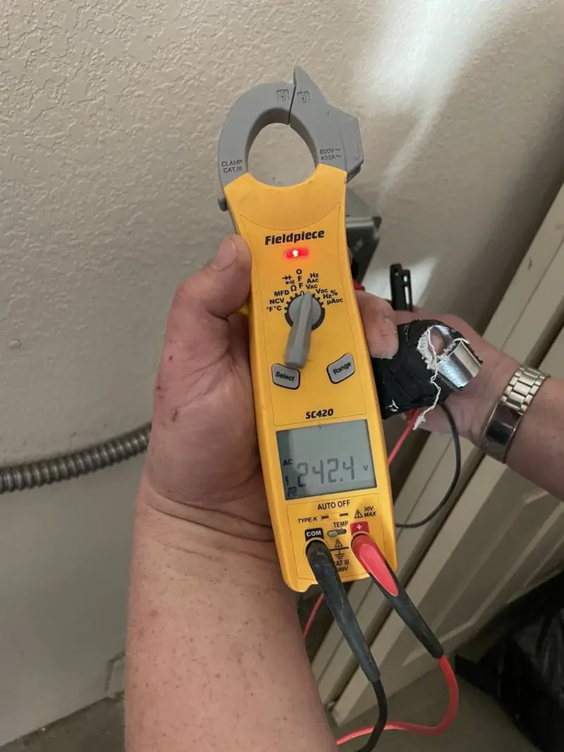 Voltage testing with clamp meter during Whole House Surge Protector in Rockwall
